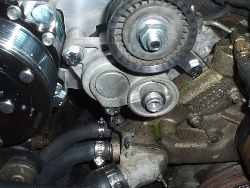 Torque all bolts as specified, idler must be removed to torque lower tensioner bolt